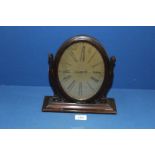 A Waltham's oval swing Clock.