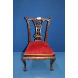 An elegant and charming miniature Chippendale style Mahogany side Chair having a carved and