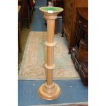 A light wooded column jardiniere stand, 39" tall.