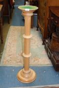 A light wooded column jardiniere stand, 39" tall.