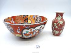 A Japanese Satsuma bowl, circa 1900, together with a small pink vase having floral decoration.
