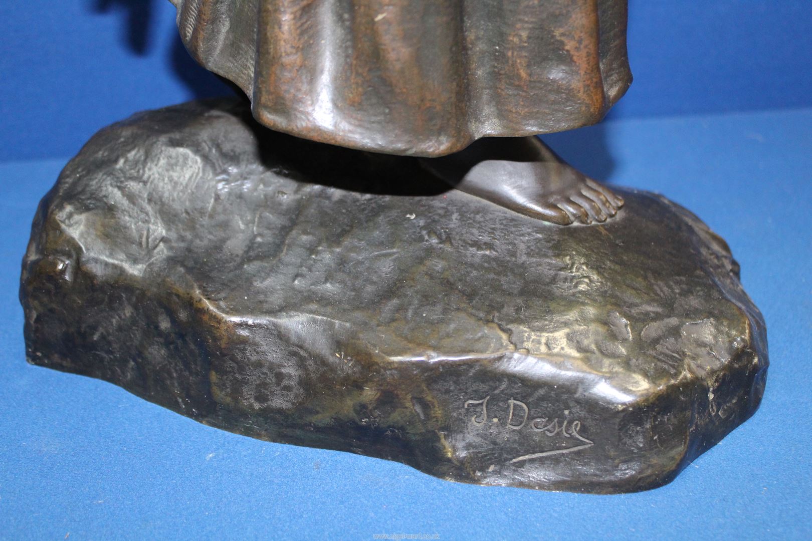 A heavy cast Bronze figure of a female peasant carrying firewood on her back, signed T. - Image 2 of 4