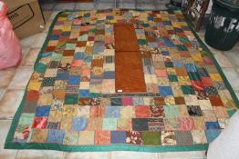 A vintage hand-made Patchwork throw 'square pattern' with central rust coloured corduroy panel,
