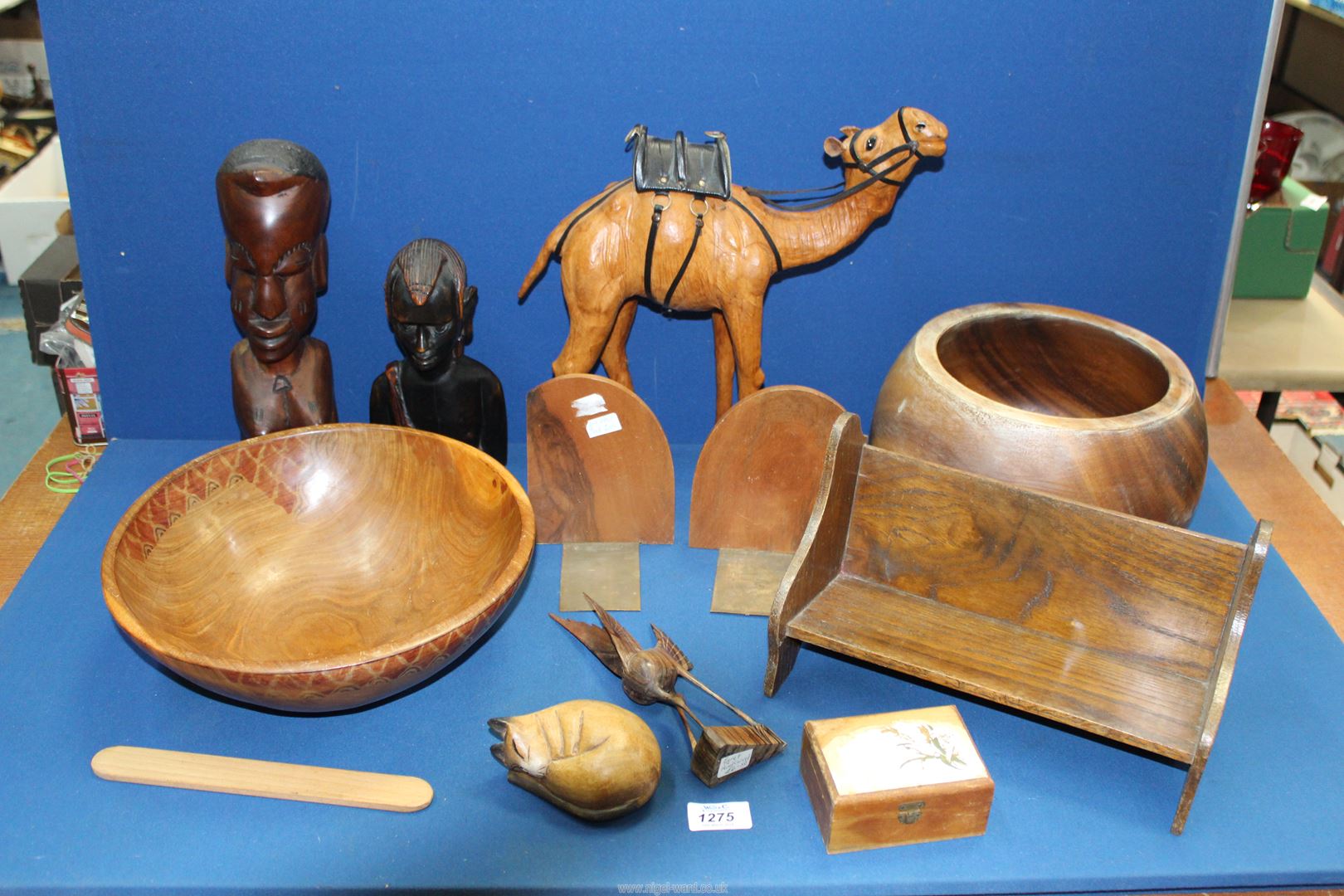 A quantity of treen including carved African busts, bowl, leather camel, etc.
