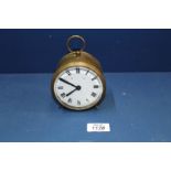 A circular brass drum Railway clock having white enamel face,