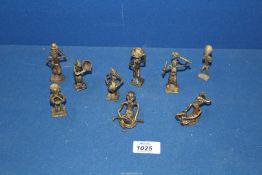 A group of nine early to mid 20th century Ashanti/Akan bronze weight figures.