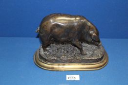 A Bronze model of a Sow on stepped base, signed J. Moigniez to base, 10'' wide overall x 6'' high.