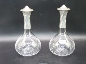 A pair of decanters having French pewter necks and lids, lids marked "Les Etains due Rouergue".