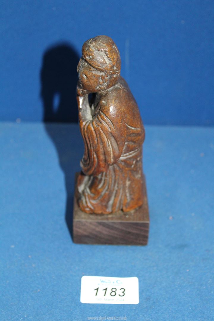 An early Chinese woodcarving of a flautist, probably Ming dynasty, 6'' tall. - Image 2 of 4