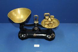 A pair of Libra Scales Co. scales with brass dish, including weights.