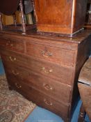 A 19th century Oak Chest of three long and two short Drawers standing on splay bracket feet with a