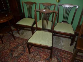 A set of four Georgian type Mahogany Dining Chairs having fretworked splats and drop-in seat.