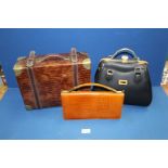 A small case (mock crocodile skin), a brown vintage handbag and a large black handbag.