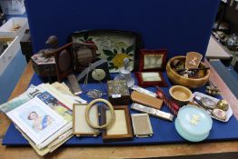 A quantity of miscellanea including Treen bowl, rattle, napkin rings, various photograph frames,