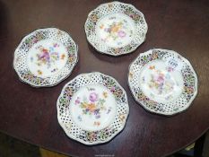 Four Schumann Dresden Pierced porcelain dishes, floral decoration, two damaged, circa 1930.