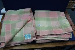 A pair of 'Kaiapoi' wool blankets in pale pink, green and cream, Made in New Zealand.