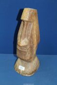 A wooden figure of Easter Island head, 15 1/2'' tall.