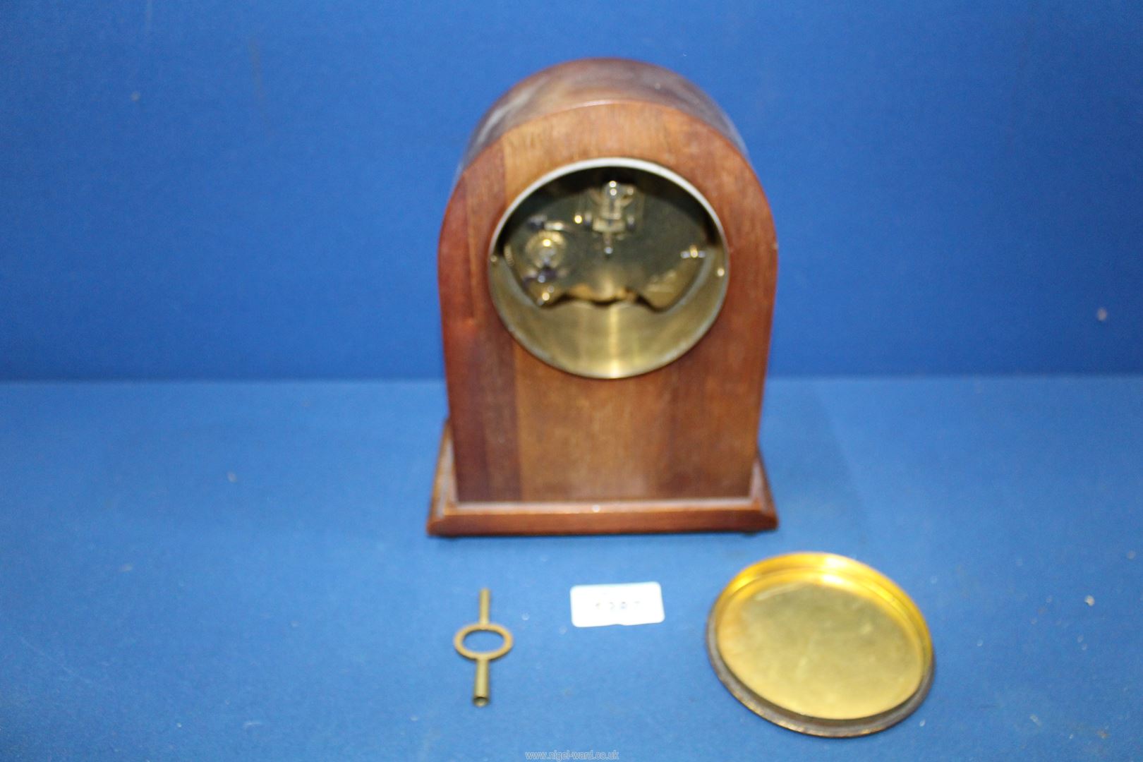 A Mantle clock with shell marquetry design, with key, 8 1/2" tall x 6 1/2" wide. - Image 2 of 2