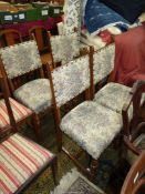 A set of four Oak framed Dining Chairs with turned front legs and "H" stretchers,