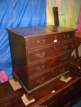 A Georgian Oak Commode standing on bracket feet, 27 1/2'' wide x 18 1/2'' deep x 28 3/4'' high.