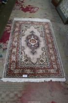 A Turkish Kayeri floss silk hearth rug in purple, orange and grey, 37 3/4 wide x 23" long.