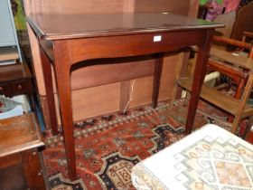 A contemporary Mahogany Side/Dining Table having a frieze drawer to one side and a drop leaf