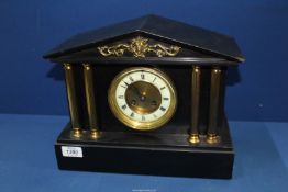 A slate Mantle Clock with gilt pillars, the movement by F. Martin, Paris, 13'' wide x 10 1/2'' high.