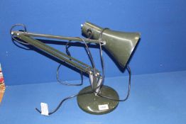 A green angle poise Desk Lamp.