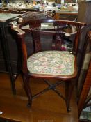 An attractive Edwardian Mahogany open armed corner Chair having intricately fretworked splats,
