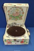A 1950's portable Decca gramaphone with Dora Roderick nursery rhyme decoration.