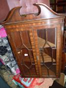 A Mahogany wall hanging corner display cabinet having a pair of opposing seven pane glazed doors