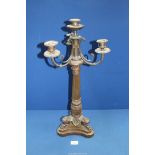 A heavy bronze metal four light Candelabrum having a tapering reeded column, swept sconce supports,