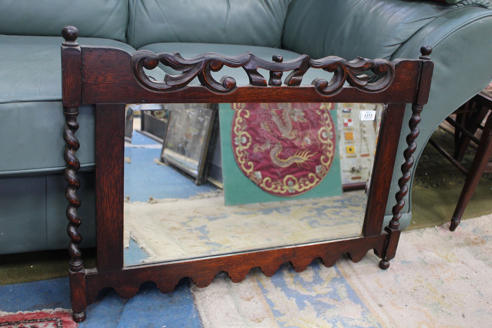 An Oak framed bevel plated wall Mirror with mirrored barley twist side pillars,