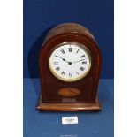 A Mantle clock with shell marquetry design, with key, 8 1/2" tall x 6 1/2" wide.