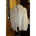 An Edelson ladies Blue Fox fur Jacket with pale blue lining, size 18.