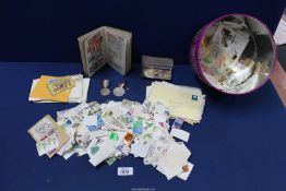 A quantity of loose stamps, letters, etc. and a Little black Stock book containing stamps.