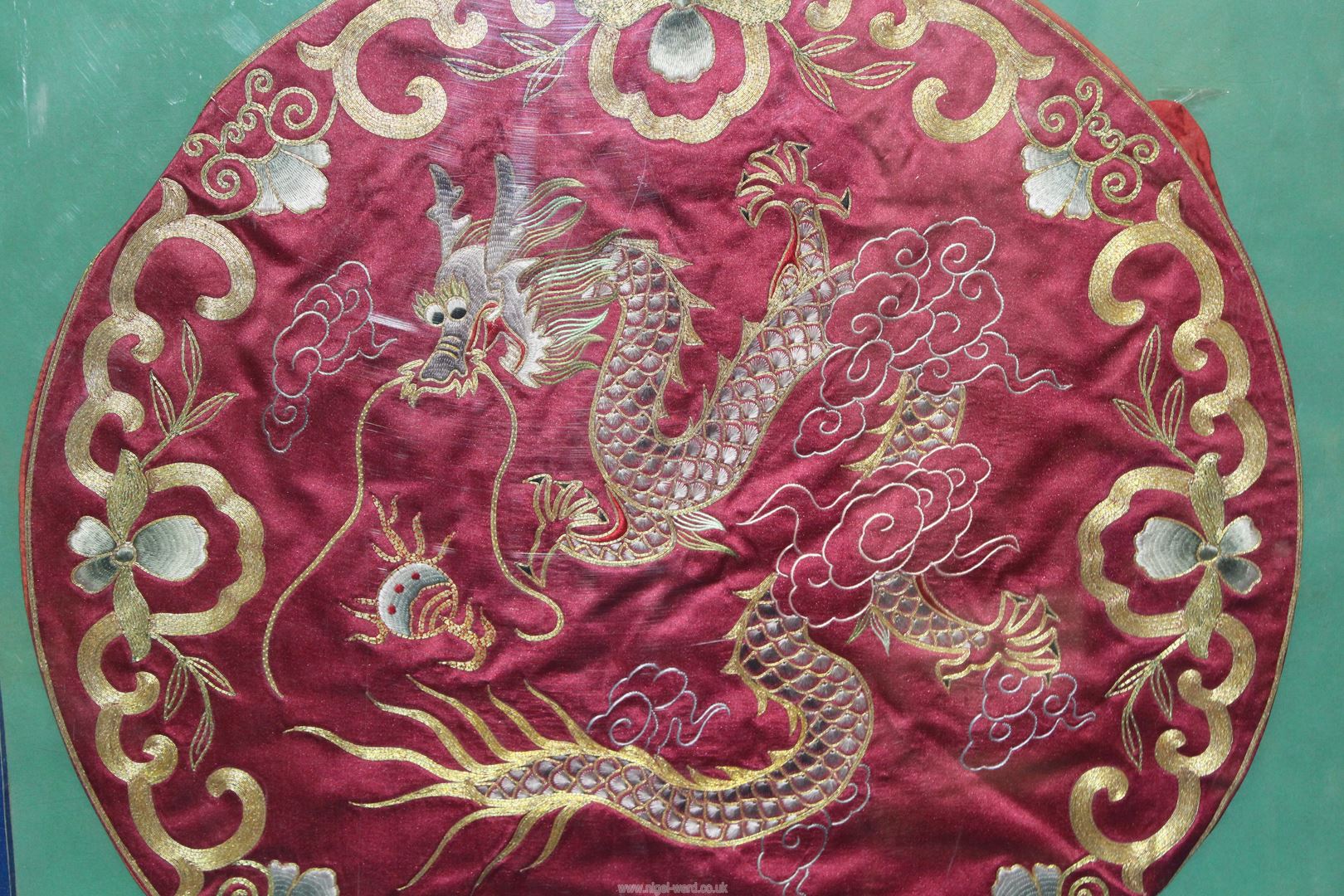 An oriental circular embroidery of a Dragon, 17 1/2" diameter. - Image 2 of 2