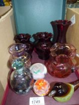 A small quantity of glass including Ruby red vases, cranberry jug, paperweights, stoppered bottle,