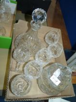 A cut glass brandy Decanter (chip to rim) and six matching brandy glasses and a cut glass jar and