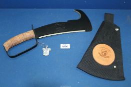 A Woodman's Pal Machete (unused), presented by the US Army War College, with blade sharpening stone.