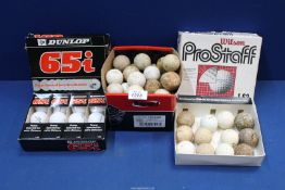 A quantity of Golf balls to include two boxes of old golf balls and a box of Dunlop 65 balls.