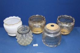 Five glass lamp shades including a set of three pale amber, one clear and one white.