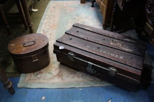 A Metal hat box in simulated oak paint finish, 19th century, original condition and a Tin trunk,