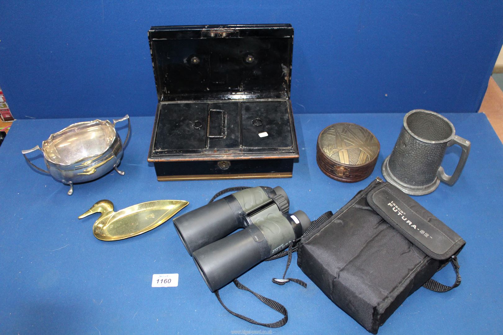 A quantity of miscellanea to include; metal cash tin, Tasco 12 x 50 binoculars, plated sucrier,