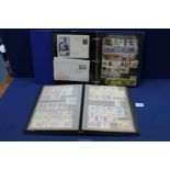 Two Stock books/albums of world and new stamps including First day covers.