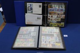 Two Stock books/albums of world and new stamps including First day covers.