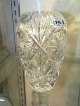 A heavy Bohemian style intricately cut glass vase, 8" tall.