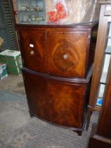 A contemporary bow fronted Mahogany cocktail/drinks Cabinet,