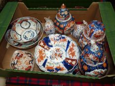 A quantity of Imari china including three ginger jars, bowls, pair of rabbits etc,