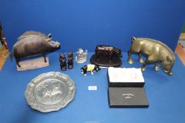A quantity of pigs including stylised metal boar, two pig trinket pots,
